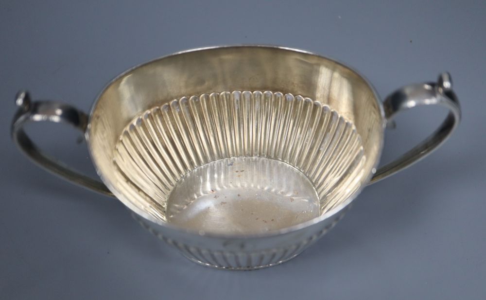 An Edwardian four piece demi-fluted oval silver tea and coffee set, Mappin & Webb, Sheffield, 1902, gross 38oz.